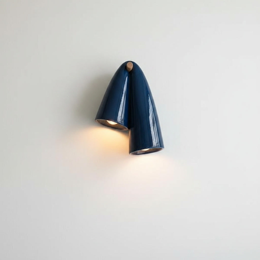 Cobalt Blue ceramic wall sconce with glossy dual-cone ceramic body and natural wood-toned mount