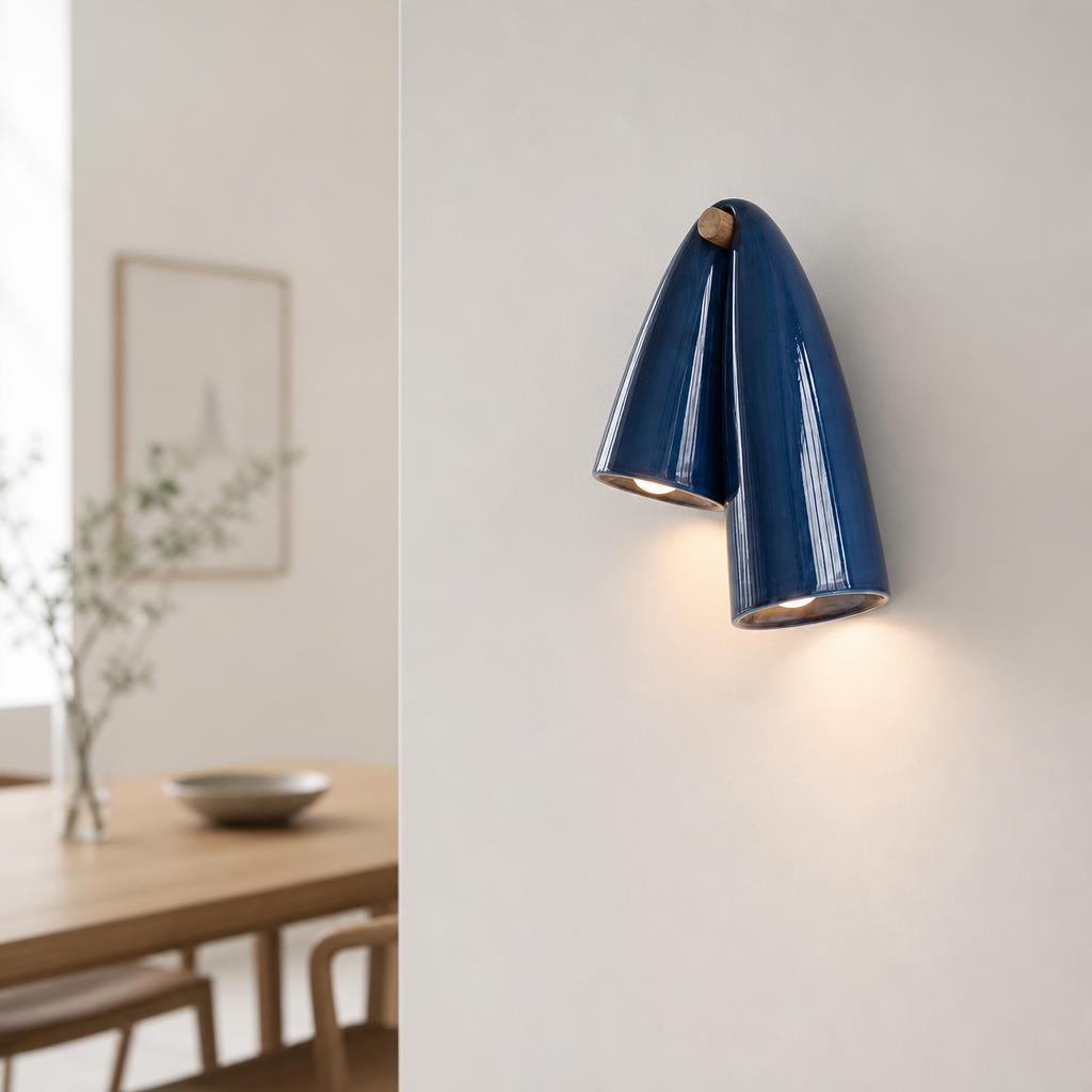 Cobalt Blue ceramic wall sconce mounted on a neutral wall in a styled modern interior