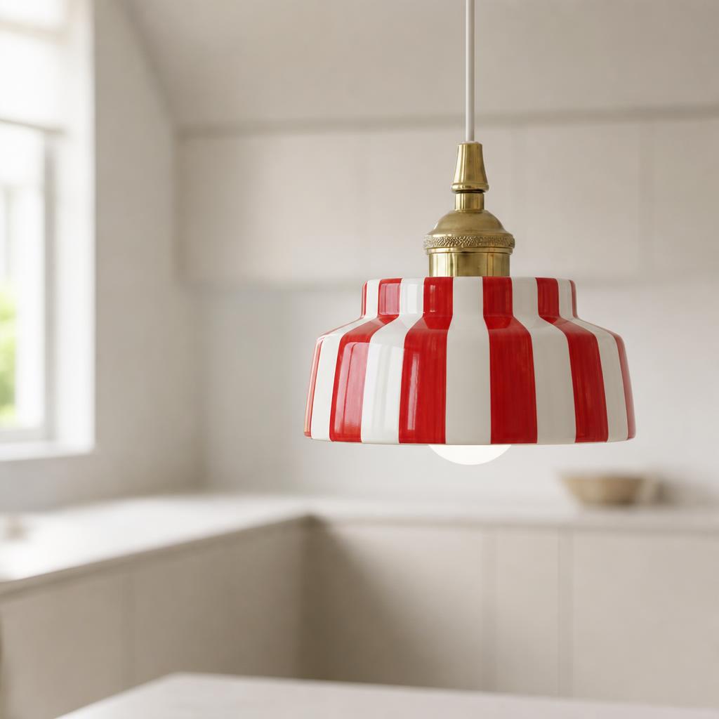 Red Striped Ceramic Pendant Light with Brass-Tone Cap shown in a styled interior view